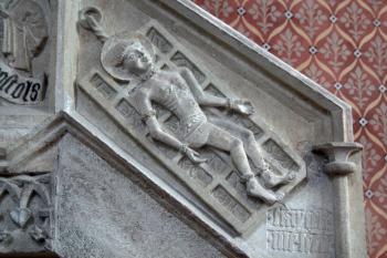 patron kostela sv. Vavřinec na roštu - reliéf na zábradlí schodiště na kazatelnu ( © Pavel Zany Komárek 11. 9. 2010)