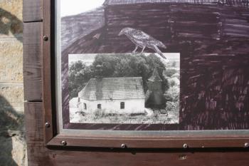 Kostelní areál na počátku 20. století ( © Ivan Grisa 09/2010, informační tabule u kostela)